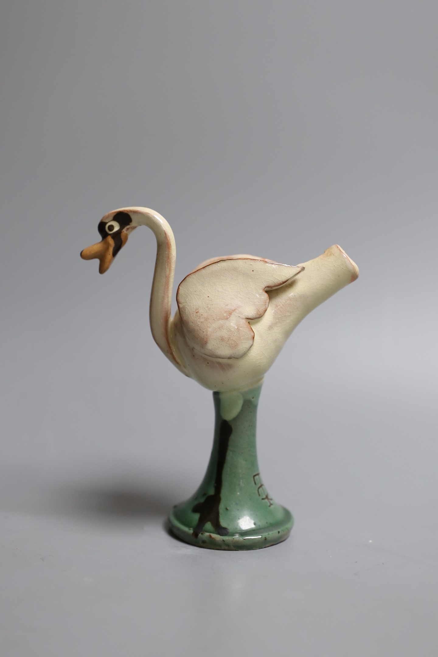 An unusual Studio ware novelty pottery swan whistle, makers monogram TR, 14 cms wide